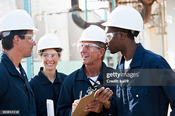 diverse group of workers at manufacturing plant - blue collar workers group stock pictures, royalty-free photos & images