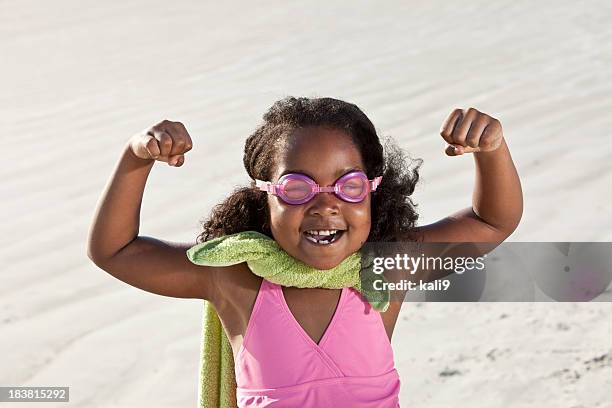 superhero at the beach - kid strong stock pictures, royalty-free photos & images