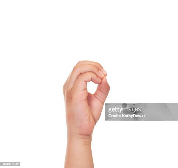 child using american sign language letter o - o stockfoto's en -beelden