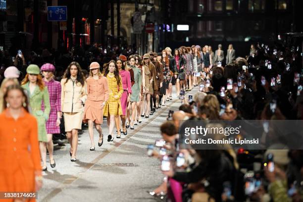 Models walk the runway during the CHANEL Metiers D'Art Fashion Show on December 07, 2023 in Manchester, England.