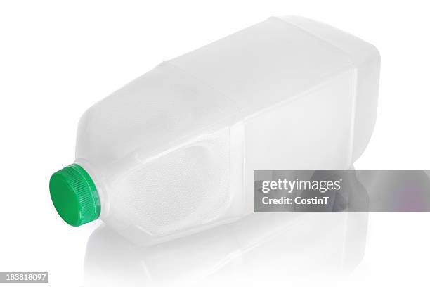 unlabeled milk jug laying on side with reflection on white - milk jug stock pictures, royalty-free photos & images