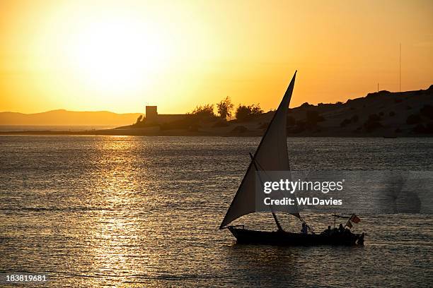 dhow at sunset - felucca stockfoto's en -beelden