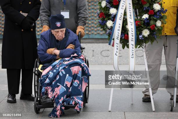 Year-old U.S. Army Air Forces Lt. Col. George Burson participates in a wreath laying ceremony at the National World War II Memorial December 7, 2023...