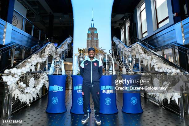 Shaun-Wright Phillips visits the Empire State Building with Manchester City F.C. Treble Trophies at The Empire State Building on December 07, 2023 in...