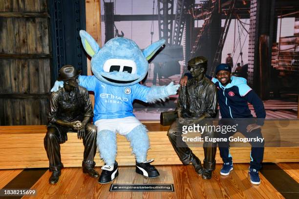Moonchester and Shaun-Wright Phillips visit the Empire State Building with Manchester City F.C. Treble Trophies at The Empire State Building on...