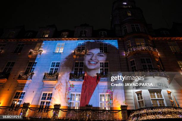 The portrait of 2023 Nobel Peace Prize winner Narges Mohammadi is projected on the facade of the Grand Hotel in central Oslo prior to the Nobel Prize...
