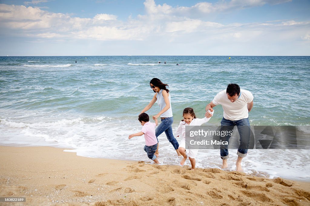 Family having fun at the beach