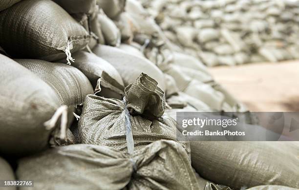 sandbag wall prepared for a major river flood - sandbag stock pictures, royalty-free photos & images