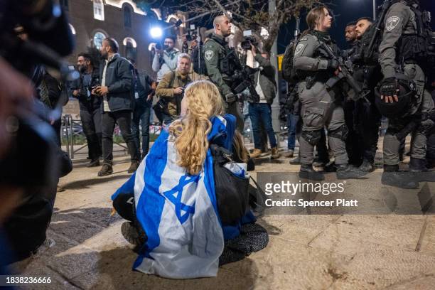 Demonstrators confront a heavy police presence during a protest dubbed the "March of the Maccabees" on December 07, 2023 in Jerusalem. The protest...