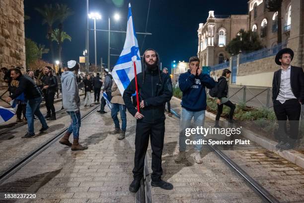 Demonstrators confront a heavy police presence during a protest dubbed the "March of the Maccabees" on December 07, 2023 in Jerusalem. The protest...