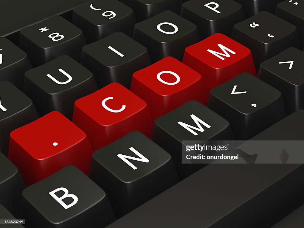 .Com writing on keyboard keys
