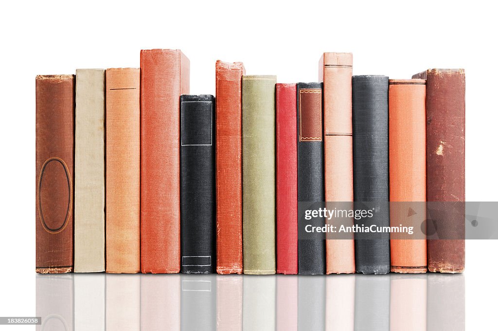 Old leather covered books isolated on white background