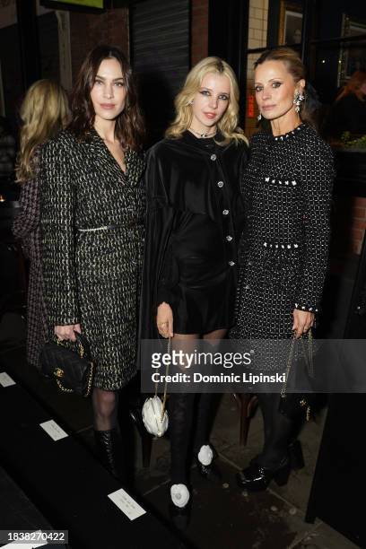 Alexa Chung, Greta Bellamacina and Laura Bailey attend the CHANEL Metiers D'Art Show on December 07, 2023 in Manchester, England.