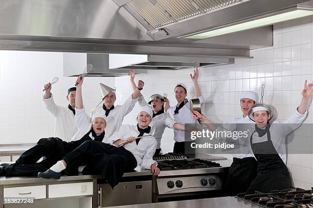 class photo of cheering chef students in kitchen - organized group photo stock pictures, royalty-free photos & images