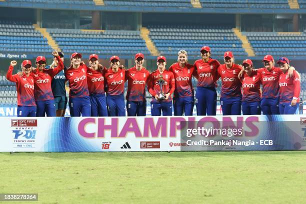 England players celebrate with series trophy during the 3rd T20 International match between India Women and England Women at Wankhede Stadium on...
