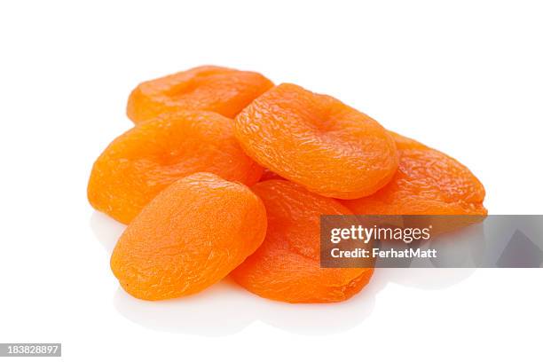 a stack of dried apricots against a white background - dried stock pictures, royalty-free photos & images