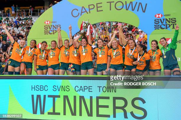 Australia's Charlotte Caslick lifts the trophy with her teammates after Australia won the women's HSBC World Rugby Sevens Series 2023 final match...