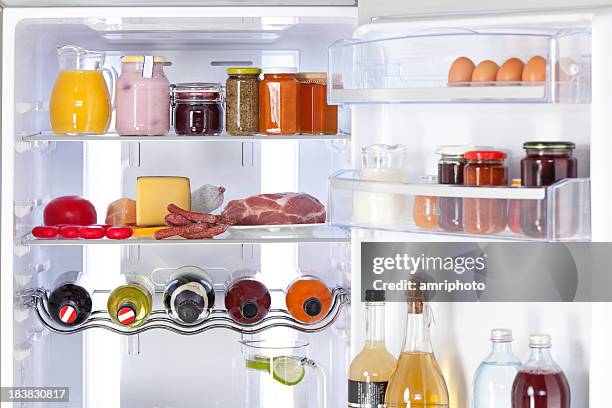 fridge with nutrition and drinks - beverage fridge stock pictures, royalty-free photos & images