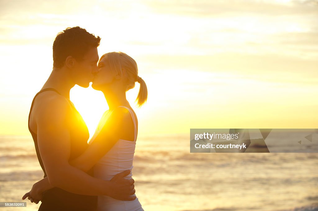 Couple kissing on the beach