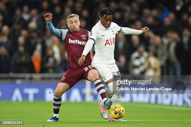 Jarrod Bowen of West Ham United battles for possession with Destiny Udogie of Tottenham Hotspur during the Premier League match between Tottenham...