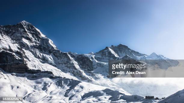 eiger and mannlichen in the winter. - monch stock pictures, royalty-free photos & images