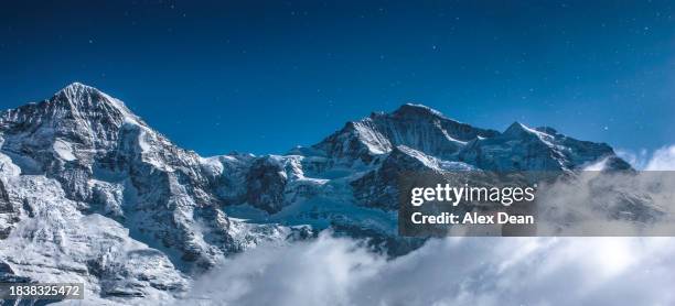 eiger and diamond dust - monch stock pictures, royalty-free photos & images