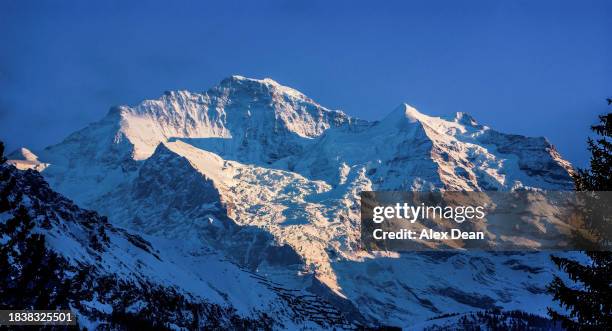 eiger and silberhorn at sunset - monch stock pictures, royalty-free photos & images