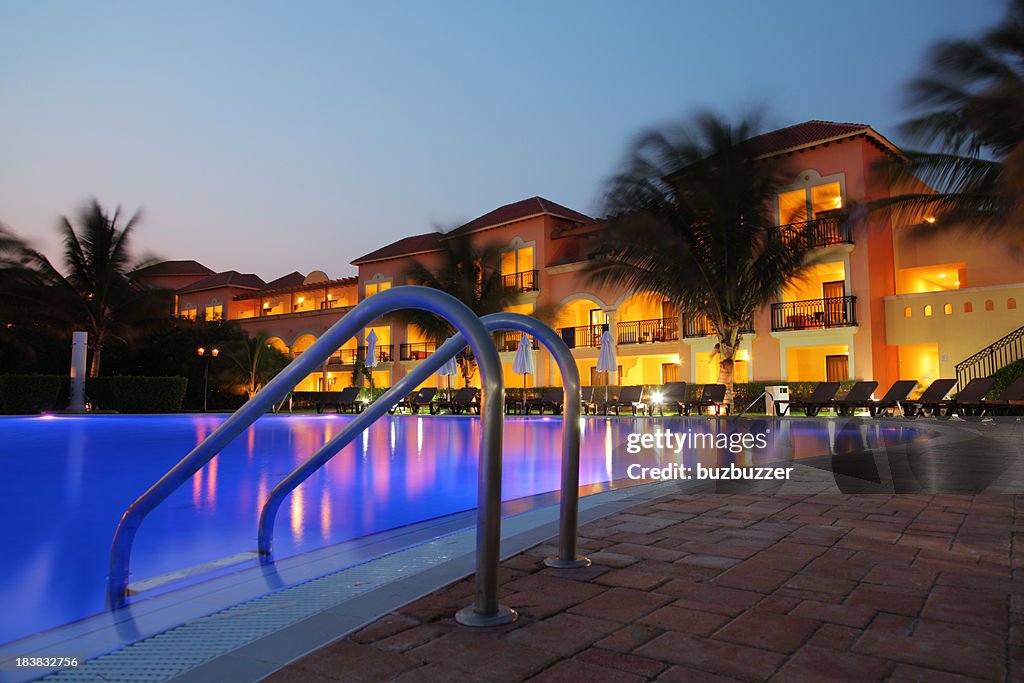 Tropical Hotel Pool at Sunset