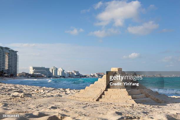 chichen itza sandcastle pyramid on topical hotel beach, cancun, mexico - mexico skyline stock pictures, royalty-free photos & images
