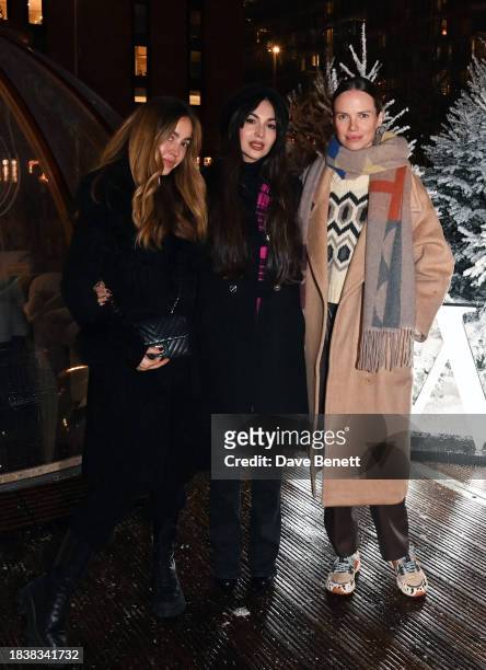 Rosa Crespo, Zara Martin and Alicia Rountree attend a special Christmas event hosted by IWC at Glide Battersea Power station on December 07, 2023 in...