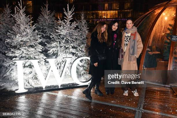 Rosa Crespo, Zara Martin and Alicia Rountree attend a special Christmas event hosted by IWC at Glide Battersea Power station on December 07, 2023 in...