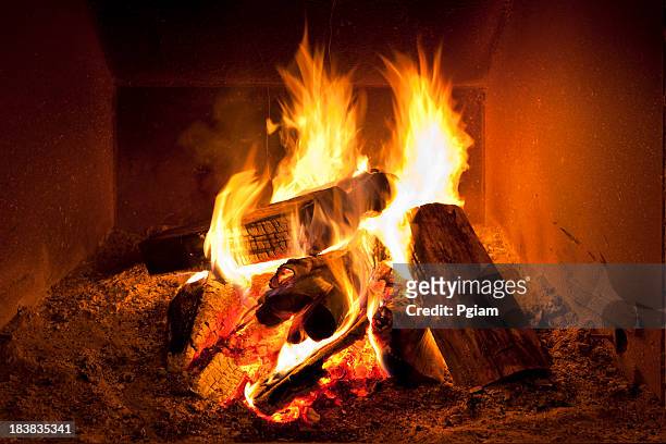 fireplace flames in winter - firewood stock pictures, royalty-free photos & images