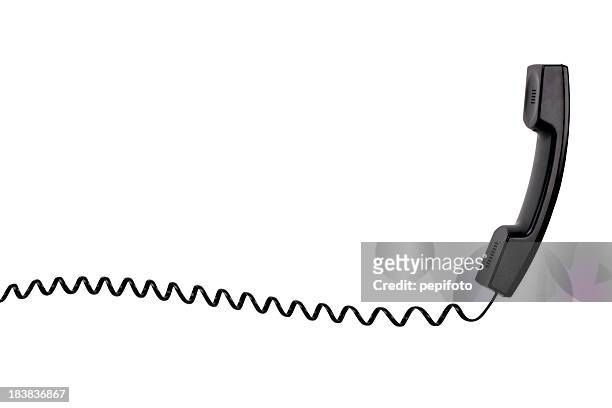 a black telephone with a spiral cord - telefonlur bildbanksfoton och bilder