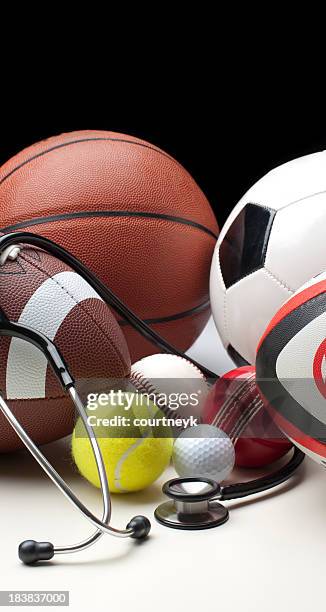 different sports balls with stethoscope - soccer doctor stock pictures, royalty-free photos & images