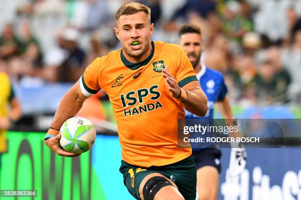 Australia's Nathan Lawson runs with the ball to score a try during the men's HSBC World Rugby Sevens Series 2023 final match between Australia and...