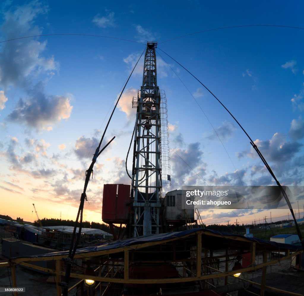 Drilling rig silhouette during beatifull sunset