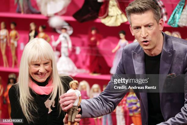 Barbie collector Bettina Dorfmann and Host Steffen Hallaschka on stage during the "2023! Menschen, Bilder, Emotionen" TV show on December 07, 2023 in...