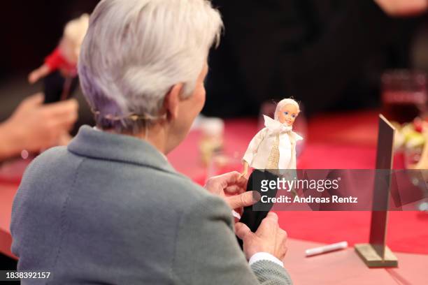 Marie-Agnes Strack-Zimmermann looks at a Barbie doll during the "2023! Menschen, Bilder, Emotionen" TV show on December 07, 2023 in Huerth, Germany.