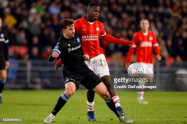 Simon Olsson of SC Heerenveen and Johan Bakayoko of PSV Eindhoven battle for the ball during the Dutch Eredivisie match between PSV Eindhoven and sc...