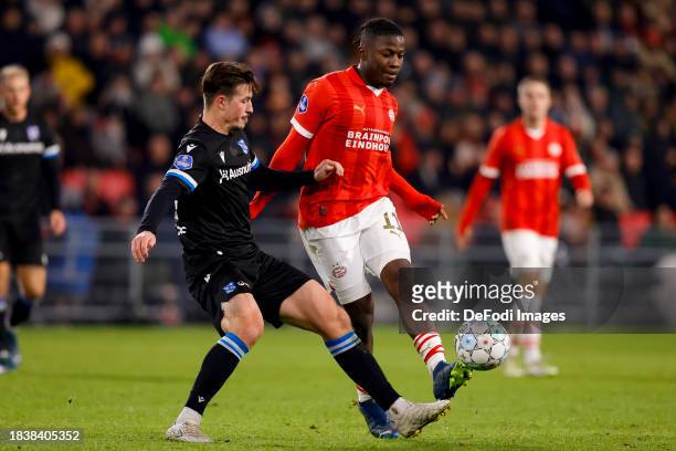 Simon Olsson of SC Heerenveen and Johan Bakayoko of PSV Eindhoven battle for the ball during the Dutch Eredivisie match between PSV Eindhoven and sc...