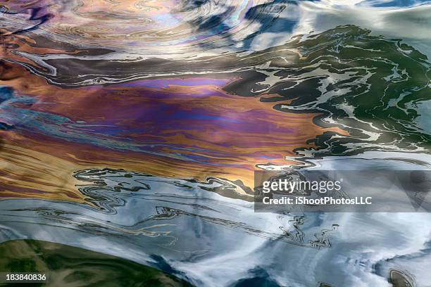 oil slick - sea pollution stock pictures, royalty-free photos & images