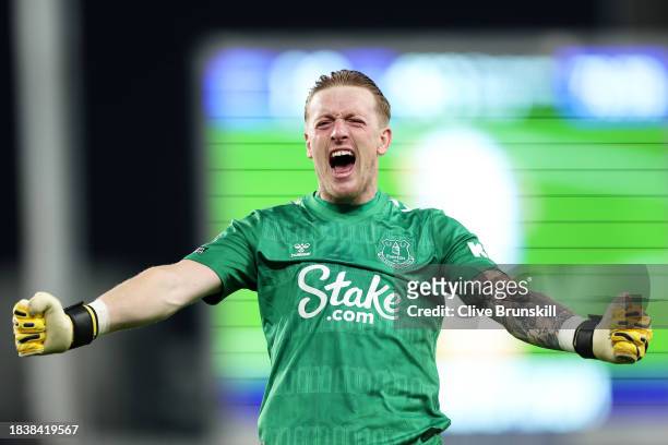 Jordan Pickford of Everton celebrates after teammate Dwight McNeil scores his team's first goal during the Premier League match between Everton FC...