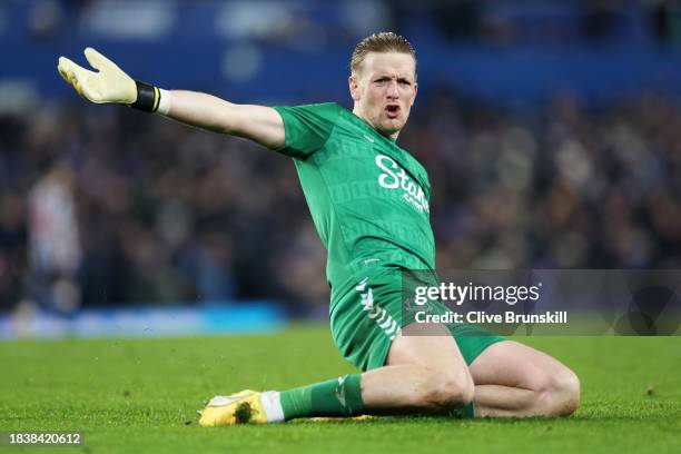 Jordan Pickford of Everton celebrates after teammate Dwight McNeil scores his team's first goal during the Premier League match between Everton FC...