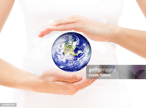 woman hands protecting earth - world hands stock pictures, royalty-free photos & images