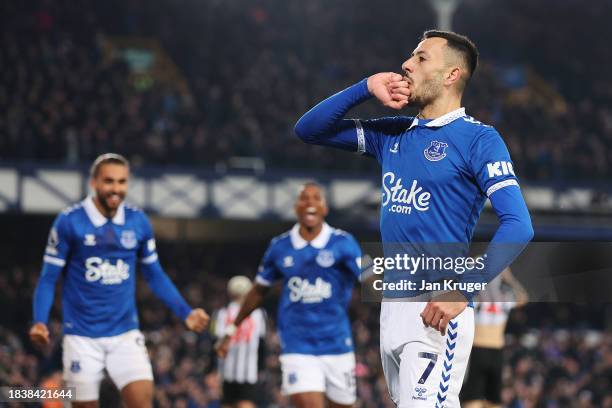 Dwight McNeil of Everton celebrates scoring his team's first goal during the Premier League match between Everton FC and Newcastle United at Goodison...