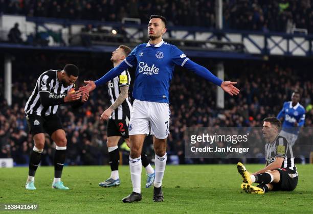 Dwight McNeil of Everton celebrates scoring his team's first goal during the Premier League match between Everton FC and Newcastle United at Goodison...