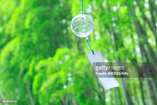 wind chime - shaking hangs stock pictures, royalty-free photos & images