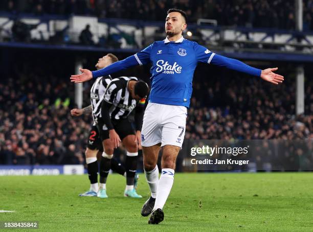 Dwight McNeil of Everton celebrates scoring his team's first goal during the Premier League match between Everton FC and Newcastle United at Goodison...