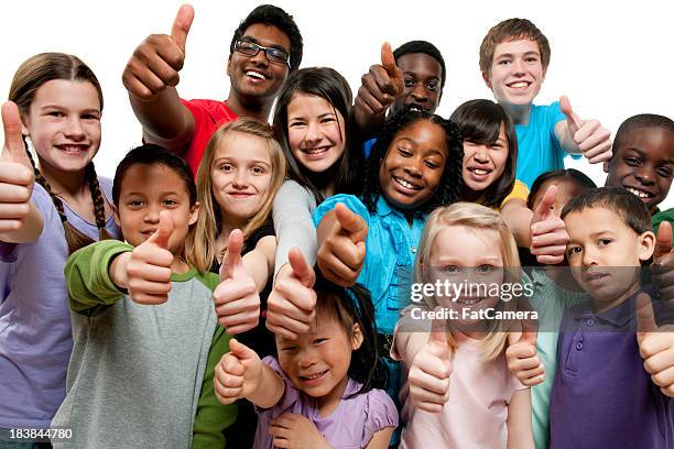 kids k through 12th grade giving thumbs up - menselijke leeftijd stockfoto's en -beelden