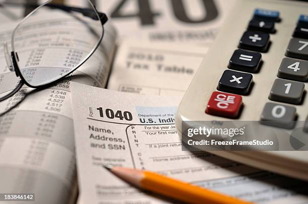 close-up of irs form 1040 - tax season stock pictures, royalty-free photos & images